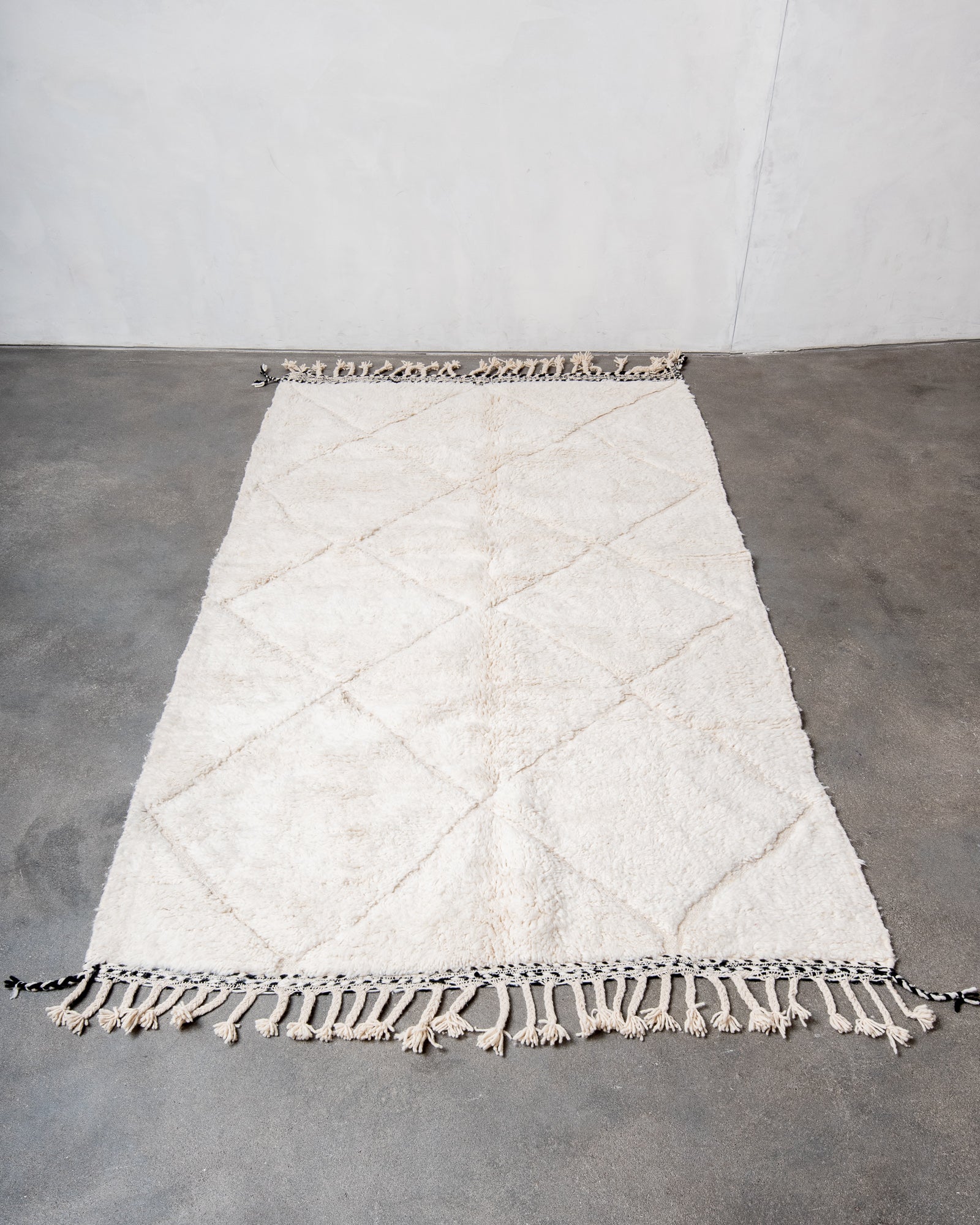 Modern, designer, handcrafted Berber rug from Morocco. Beniourain carpet with beautiful colours and patterns and fluffy wool texture.